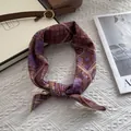 Detail of vintage floral pattern and golden edge stitching on cotton square scarf - Red