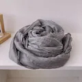 Close-up of dark grey cotton linen scarf featuring delicate lace trim detail - Gray
