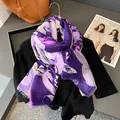 Detail of floral purple cotton linen scarf with fine fringe edges on a magazine background - 180*90CM / Purple