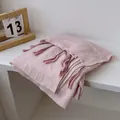Close-up of light pink cotton linen shawl with delicate purple gradient tassel fringe - Pink