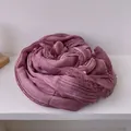 Detail of purple cotton linen scarf showing soft pleated texture and delicate lace edge - Burgundy