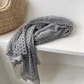 Detail of grey lightweight cotton-linen scarf featuring delicate circular lace trim edges - Light Gray