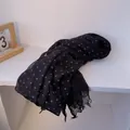 Detail of lightweight black linen scarf with blue polka dots and fringe tassel edges - Black