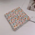 Close-up of soft cotton linen scarf featuring orange berry floral patterns and neat edges - Yellow Strawberry