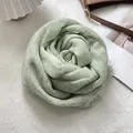 Detail of light green linen scarf with frayed edges folded into a rose flower shape - Light Green Fringed Style / 90x200cm / Aqua Green