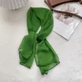 Detailed view of dark green silk scarf with black contrast stitching and soft texture - 105*47cm / Green