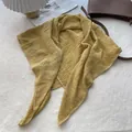Detailed view of ginger yellow pleated linen scarf with white scalloped embroidered edges - 90x90cm / Yellow