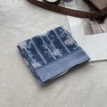 Detail of blue floral cotton-linen scarf folded on a white carpet with elegant magazine - 58*58cm / Blue