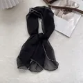 Detail of black chiffon neckerchief with decorative wavy embroidery on scalloped edges - 105*47cm / Black