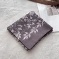 Detailed view of purple floral cotton bandana scarf showing white paisley patterns - Coffee Olive Branch