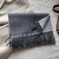 Detail of soft 100% wool scarf featuring fringe edges and grey color blocking - 180*30cm / Heather Gray + Light Gray