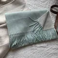 Detailed macro view of two-tone light mint and beige wool scarf with fringe edges - 180*30cm / Aqua Green and Off-white