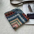 Detail of bohemian floral cotton scarf with geometric patterns on soft plush background - Fret Pattern Vintage Green