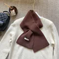 Detail of dark brown 100% Australian wool scarf with thick texture and high-quality knit - Coffee