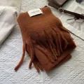 Detailed texture of caramel brown cashmere scarf with fringe and woven label - 180*30cm / Korean Pumpkin Brown