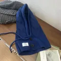 Dunkelblaue Balaclava-Mütze mit Zopfmuster, Knopfverschluss und praktischem Kordelzug - Klein-Blau