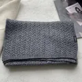 Close-up of 100% pure wool scarf with classic cable-knit texture and soft gray fabric - Gray
