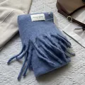 Detail shot of dusty blue knit scarf with long tassels and hand made brand label - 180*30cm / Sea Salt Blue
