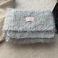Detail of light blue fluffy wool scarf with colorful BOWLOW brand label tag - Azure Blue