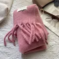 Close-up of pink tassel scarf with fluffy texture and white decorative label on knit fabric - 180*30cm / Mist Pink
