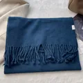 Detail of 100% pure wool scarf with soft fringe and premium fabric texture - Blogger Deep Blue