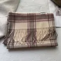 Detailed macro shot of vintage plaid wool scarf with elegant tassel trim and soft textures - 180x30cm / Pink & Beige Plaid