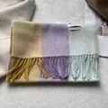Detail of soft 100% wool scarf with vibrant color blocks, long tassels and warm journey tag - 180x30cm / Yellow Purple Aqua Green