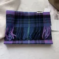 Detailed close-up of British plaid wool scarf fringe and woven Warm Journey label - 180x30cm / Grape Purple Plaid Check