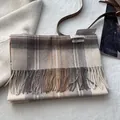 Detail showing the 100% wool label and fringe texture of the classic plaid scarf - 180*30cm / Off White