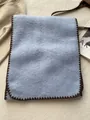 Detailed close-up of light blue wool scarf featuring dark brown blanket stitch edging - 180*60cm / Light Blue
