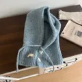 Detailed knit texture of light blue balaclava featuring white buttons and drawstring cords - Light Blue