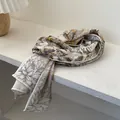 Elegant beige herringbone silk-wool scarf with botanical sketch floral prints on a shelf - 140*40cm / Beige