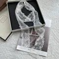 Elegant white lace ribbon scarf with floral embroidery and Sweet Love lettering detail - 160cmx9cm / White