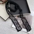 Detail of black lace ribbon scarf with floral embroidery and Sweet text for women - 160cmx9cm / Black