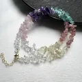 Close-up of rainbow gemstone beads showing natural crystal textures and golden clasp - Necklace Style