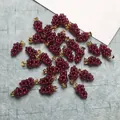 Close-up of cluster garnet grape pendants with gold-filled clasps on textured background - Gold Color Buckle