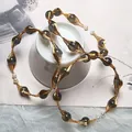 Detail of bohemian gold wire-wrapped labradorite and freshwater pearl jewelry set - Labradorite
