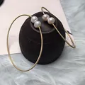 Elegant 14K gold filled wire hoop earrings featuring natural freshwater pearls - Open Wire Wrapped Pearl Style