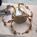 Detailed macro view of handmade 14K gold wire wrapped freshwater pearl bracelet - Freshwater Pink Pearl