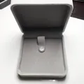 Macro shot of light gray velvet jewelry box with metal snap for necklaces or pendants - Gray Velvet Style