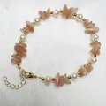 Natuurlijke zoetwaterparel armband met zonnesteen split en gouden sluiting - Zonnesteen
