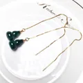 Elegant gold chain earrings with green malachite gourd pendants on ceramic tray - Threader Earrings (Pair)