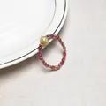 Macro shot of beads ring featuring tourmaline stones and golden rutilated quartz - Tourmaline Style