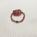 Macro shot of handcrafted strawberry quartz pixiu ring with colorful tourmaline beads - Tourmaline / Tourmaline Style 2