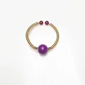 Detailed view of handmade 14K wire-wrapped ring with purple and reddish brown beads - Phosphosiderite