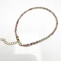 Close-up of 2.4mm candy-colored tourmaline beaded anklet with golden lobster clasp and chain - Bracelet Style / 2.4mm Bead / 16cm Length