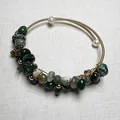 Handmade gold wire-wrapped cuff bracelet with green raw gemstones and white pearls - India Agate Pearl Open Cuff Bangle
