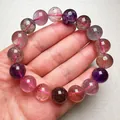 Detailansicht eines Super Seven Naturkristall Armbands mit bunten Einschlüssen - Super Seven Perlen