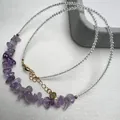 Detailed macro view of S925 silver clasp and purple crystal beaded necklace - Lavender