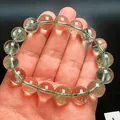 Primer plano de cuentas de cristal Green Phantom de 12mm con inclusiones naturales en muñeca - Estilo 1